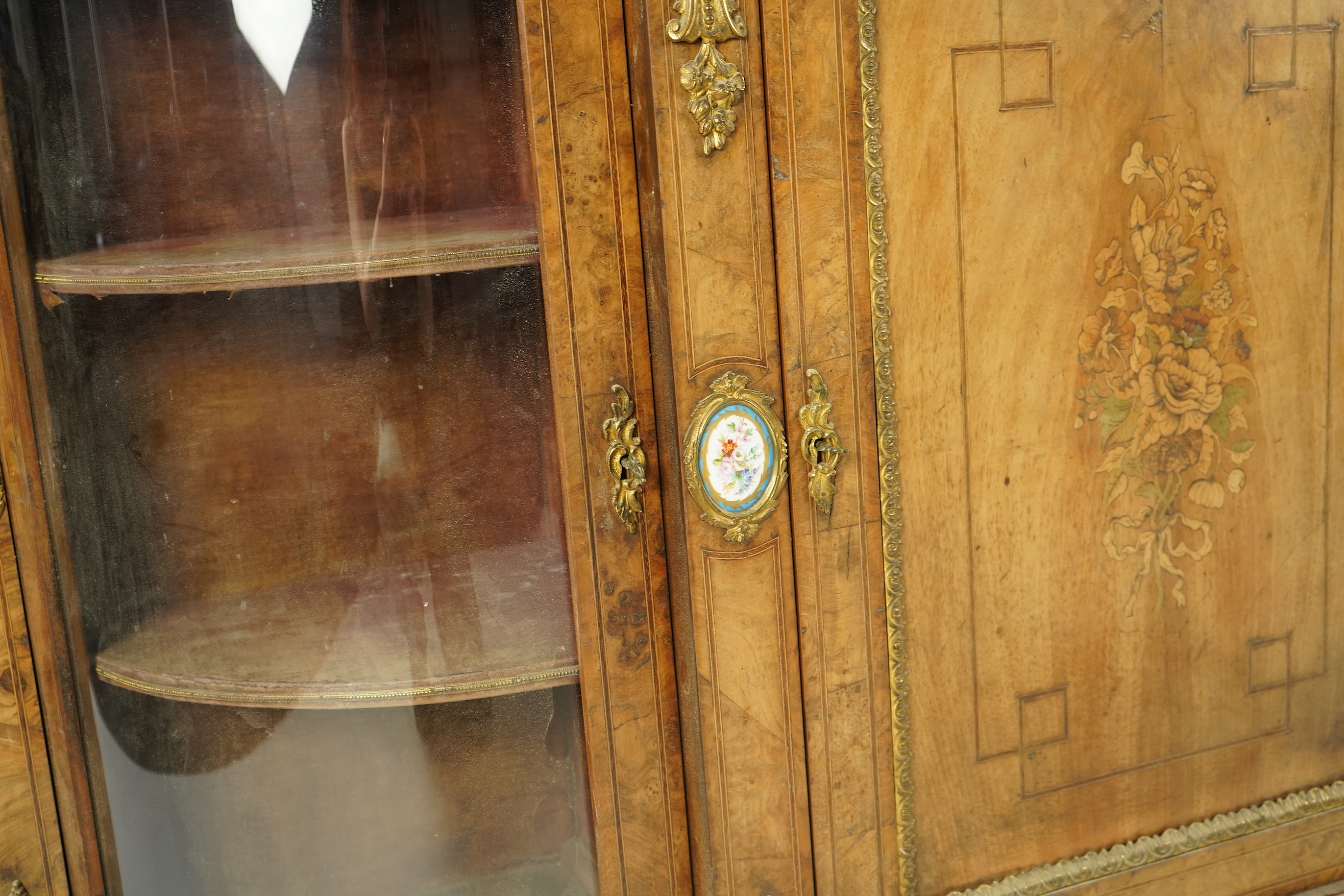 A Victorian marquetry inlaid, gilt metal mounted bowfront side cabinet